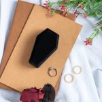 gothic-coffin-ring-box-on-journals-with-roses-and-foliage.jpeg